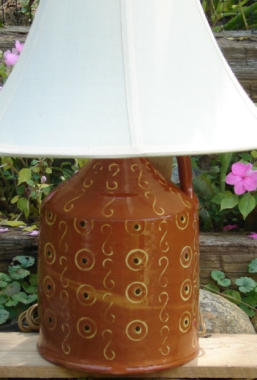redware lamp, circles and dots