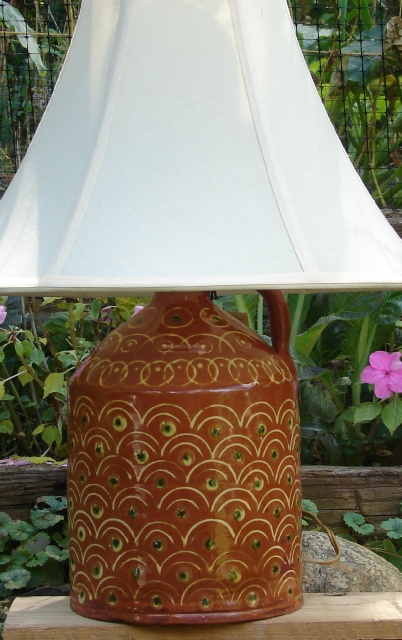 redware lamp, peacock feathers