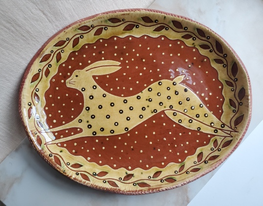 redware oval platter with leaping hare pattern by Kulina Folk Art