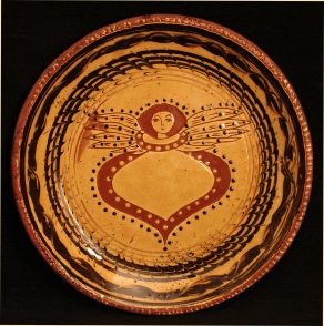 redware plate, angel with wings and mabled border