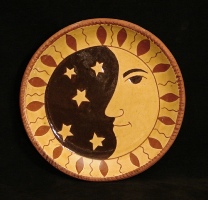 redware plate, man in the moon