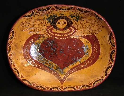 redware trencher, angel with wings