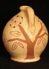 sgraffito redware sun and moon jug back