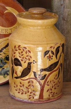 redware jar, birds eating berries