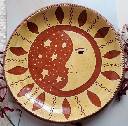 redware charger, man in the moon