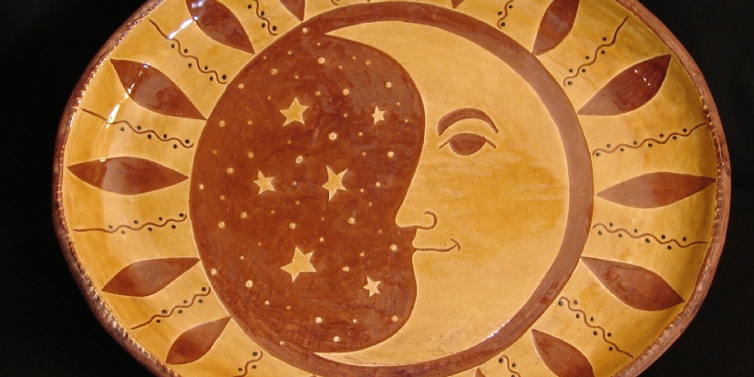 redware oval platter man in the moon