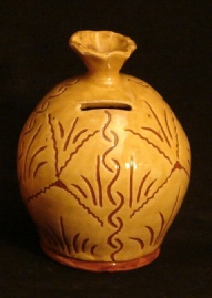 redware ovoid bank, sgraffito pattern