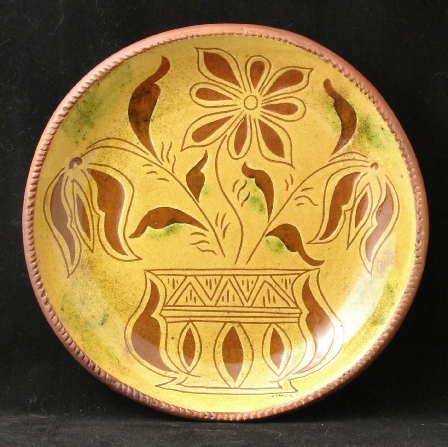 redware plate, tulips in vase